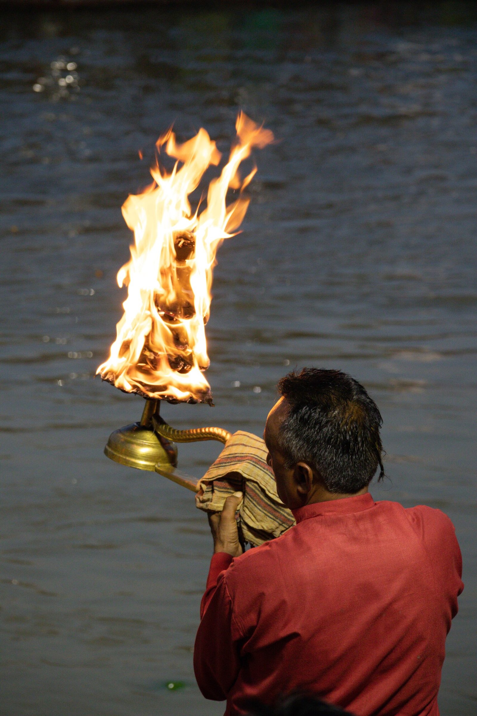 Experience the spiritual essence of the Ganga Aarti ritual by the river in Haridwar, India.
